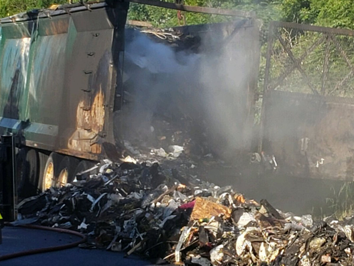 A truck transporting garbage caught fire on Highway 401 on Thursday morning.