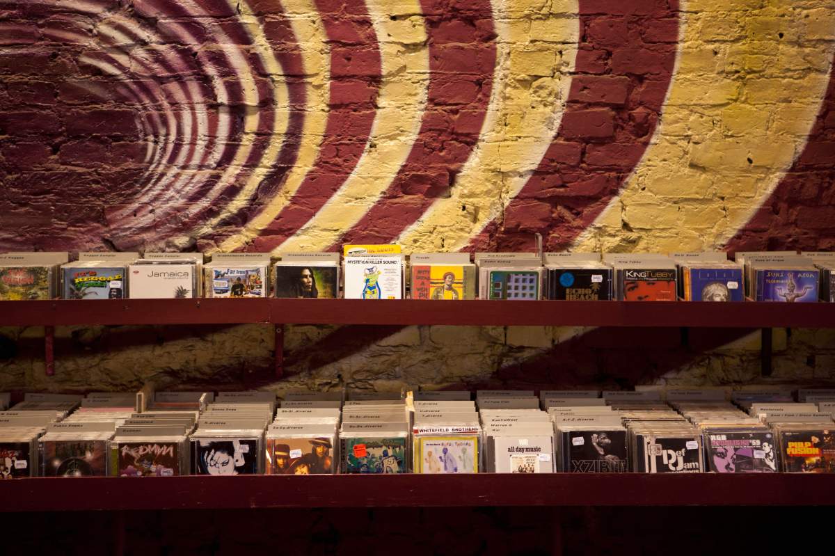 Shelves of compact discs in a record shop.