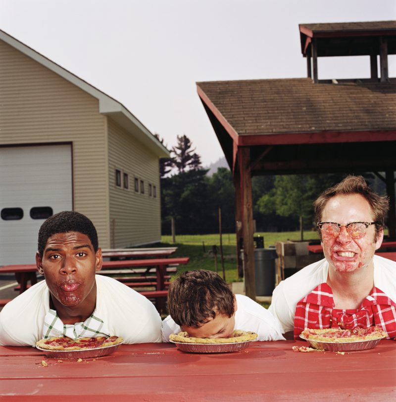 Competing in a pie eating contest. 