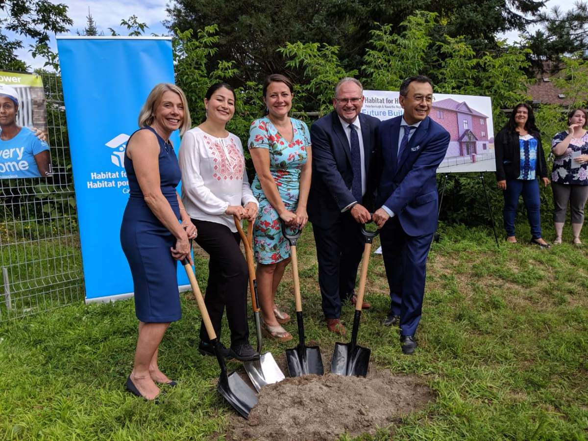 Officials pose for a photo following the press conference on Tuesday morning.