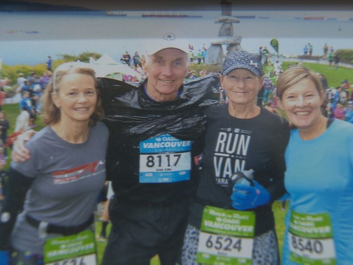 Lawrence (pictured second from left) is an avid runner and has collected multiple medals as a result of his accomplishments.