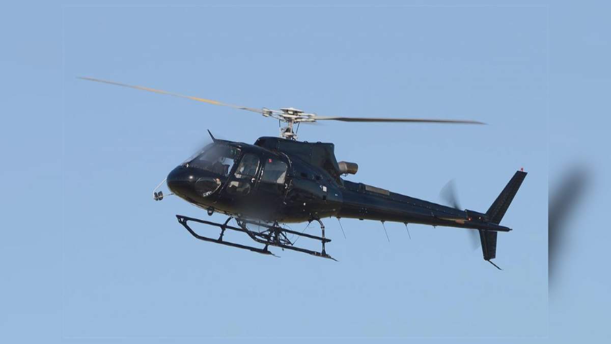 The black, unmarked helicopter at the centre of an alleged cross-border drug smuggling bust takes off from Vancouver International Airport (YVR) in 2013.