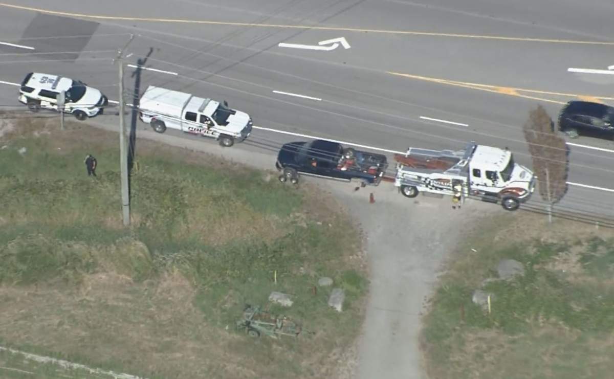 Police surround a pickup truck involved in multiple hit-and-runs on Highways 99 and 17 between Richmond and Delta on Aug. 7, 2019. The driver was arrested at the scene.