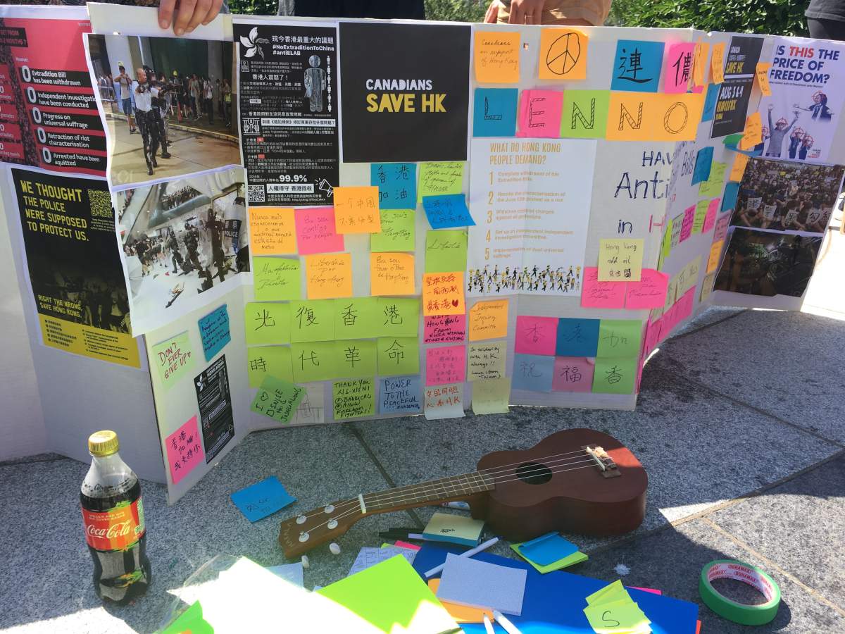 Signs of support for Hong Kong are displayed at a protest in Halifax on Aug. 17, 2019.