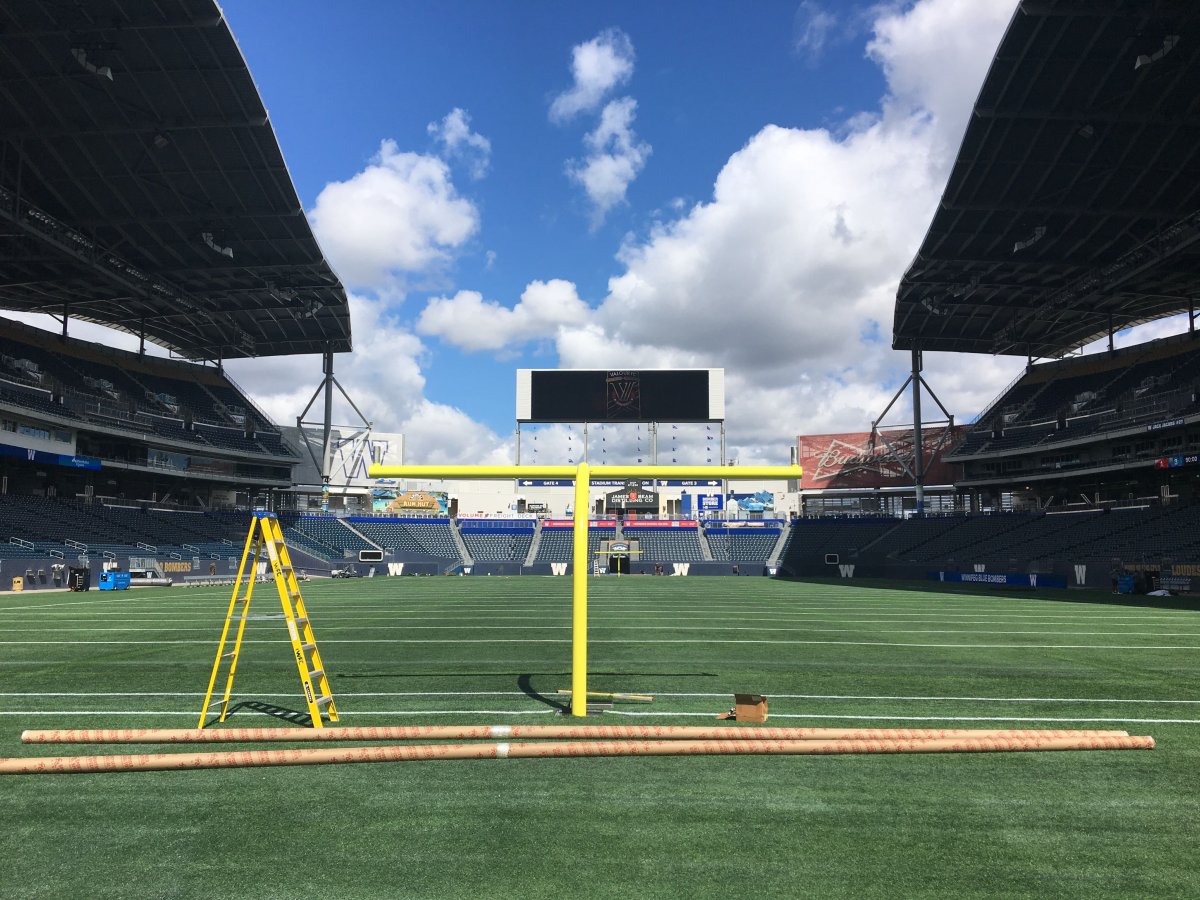 NFL goal posts being set up at IG Field on Tueday.