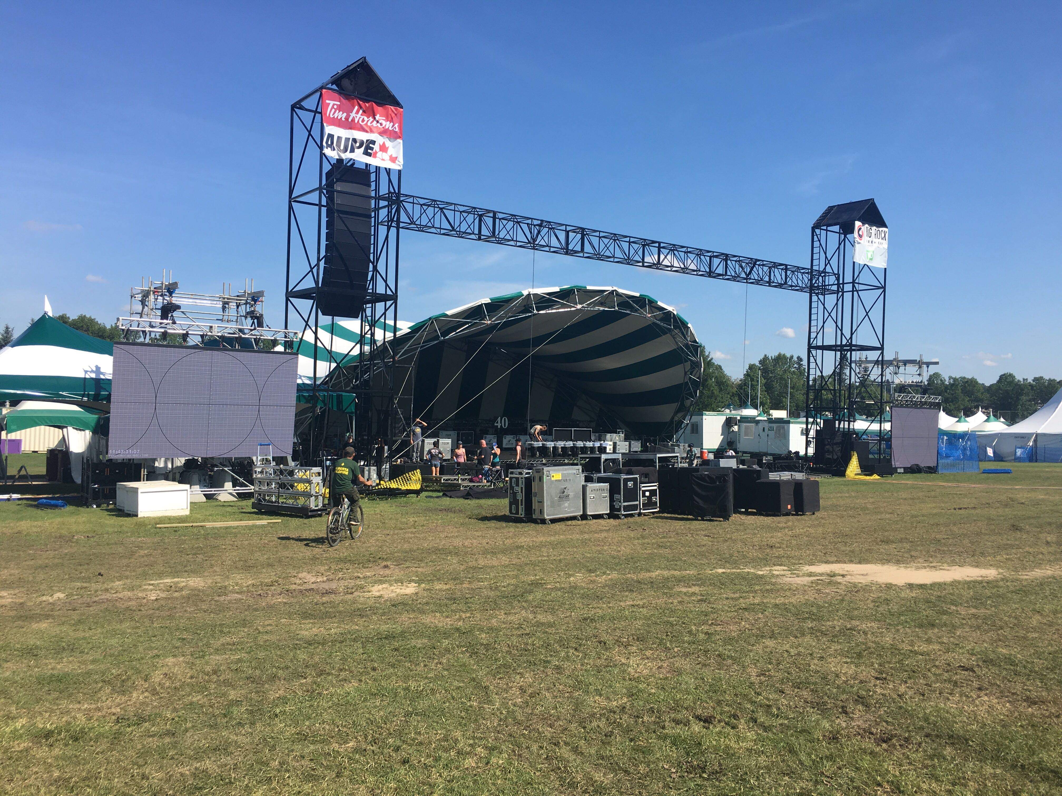Edmonton festivals truck in sand, hire meteorologist to combat record summer rainfall
