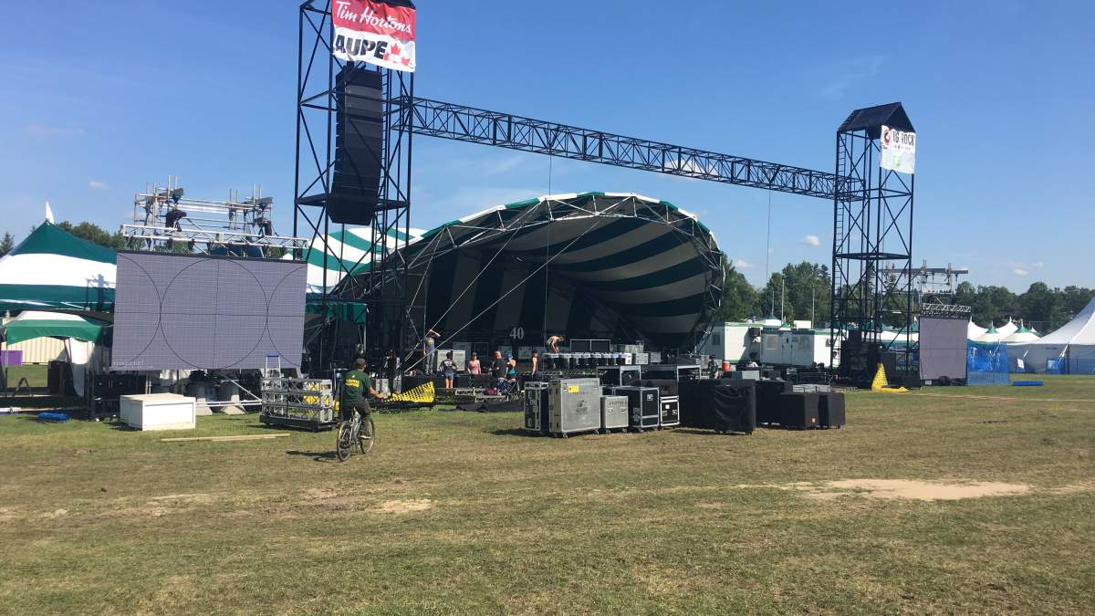 Edmonton’s summer of rain has Folk Fest trucking in sand, Fringe hiring meteorologist