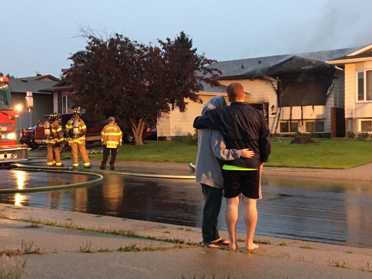 Two homes on 31 Avenue near 48 Street in southeast Edmonton's Mill Woods area were damaged by fire on Friday, Aug. 30, 2019. 