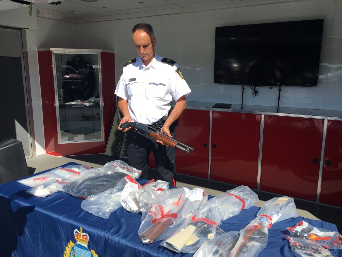 Winnipeg police show off contraband seized at the Cumberland Avenue residence and other recent raids.