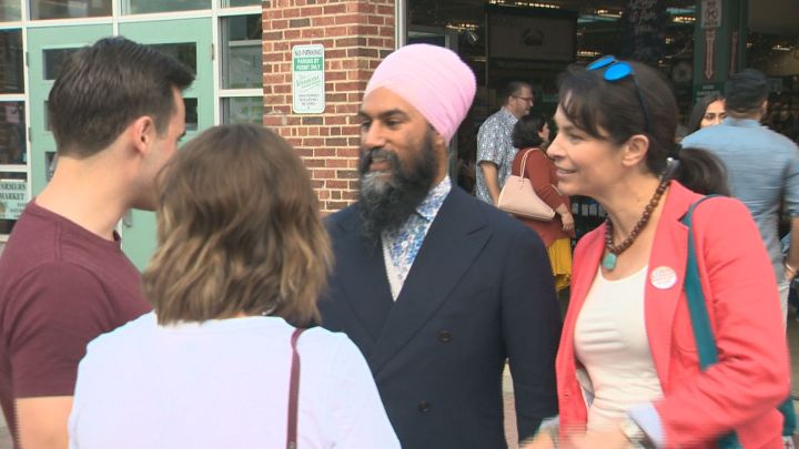 Federal NDP Leader Jagmeet Singh (second from right) and his party's candidate for Edmonton-Strathcona, Heather McPherson (far right), met with potential voters on Saturday.