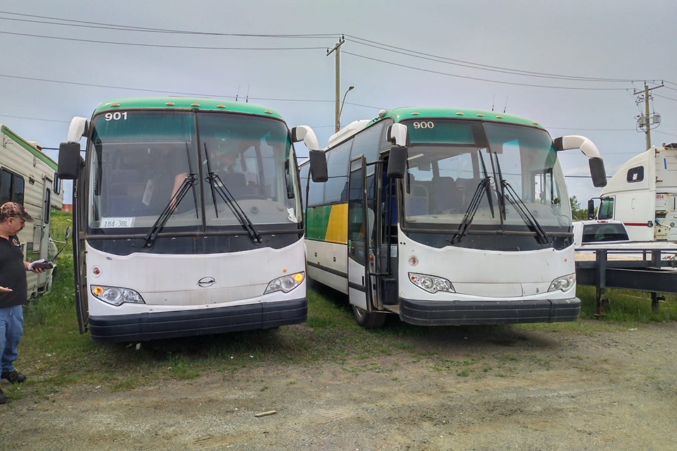 A pair of Kasper Transportation buses.