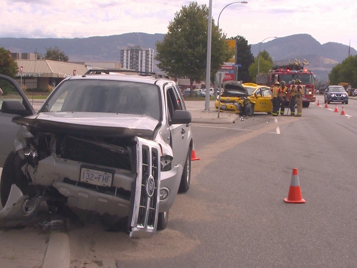A Kelowna Cabs taxi and a silver Ford SUV were involved in a two-vehicle collision along Highway 97 in Kelowna on Wednesday.