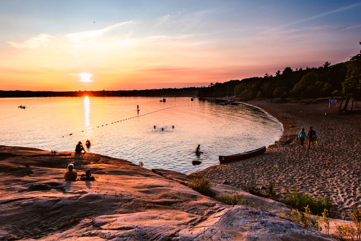 Tourists enjoy the sunset scenery in Killbear Provincial Park.