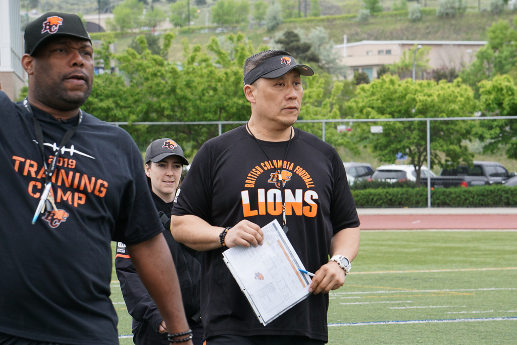 B.C. Lions offensive line coach Bryan Chiu with head coach 
BC Lions Training Camp 2019.