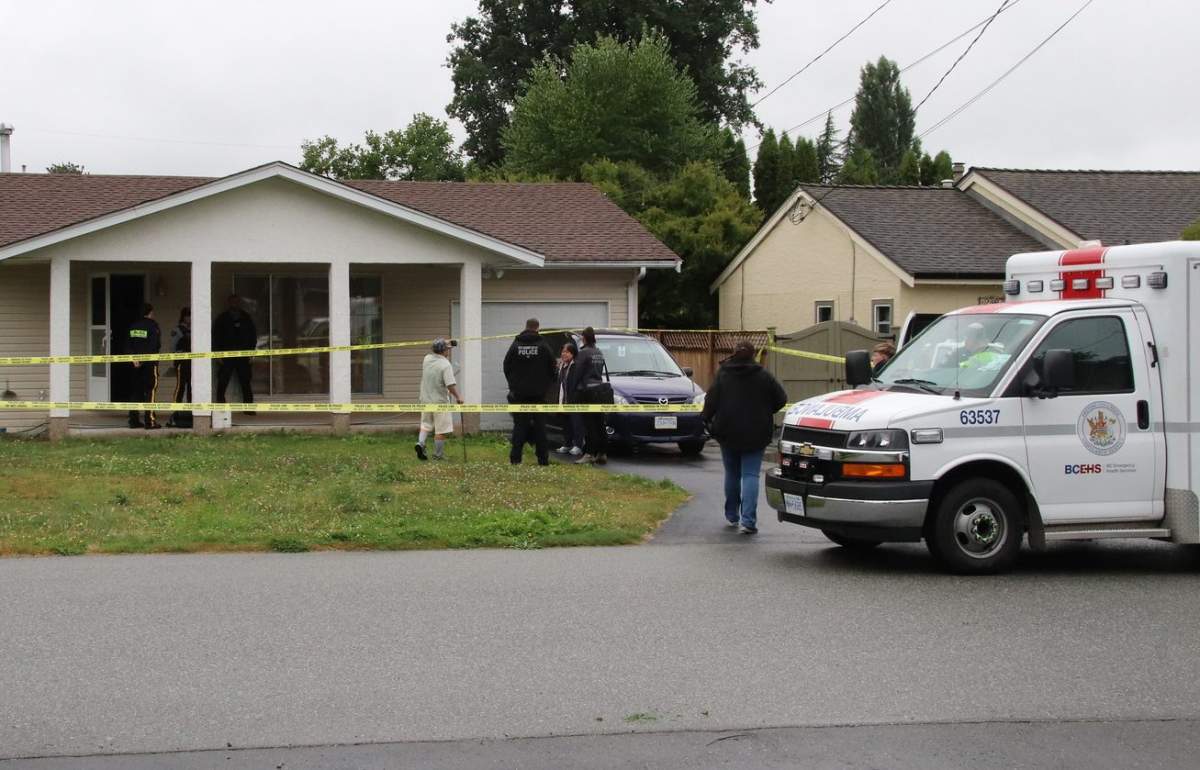 Police and ambulance outside a home in Maple Ridge where family and the Independent Investigations Office say a person was shot by police Aug. 11, 2019.
