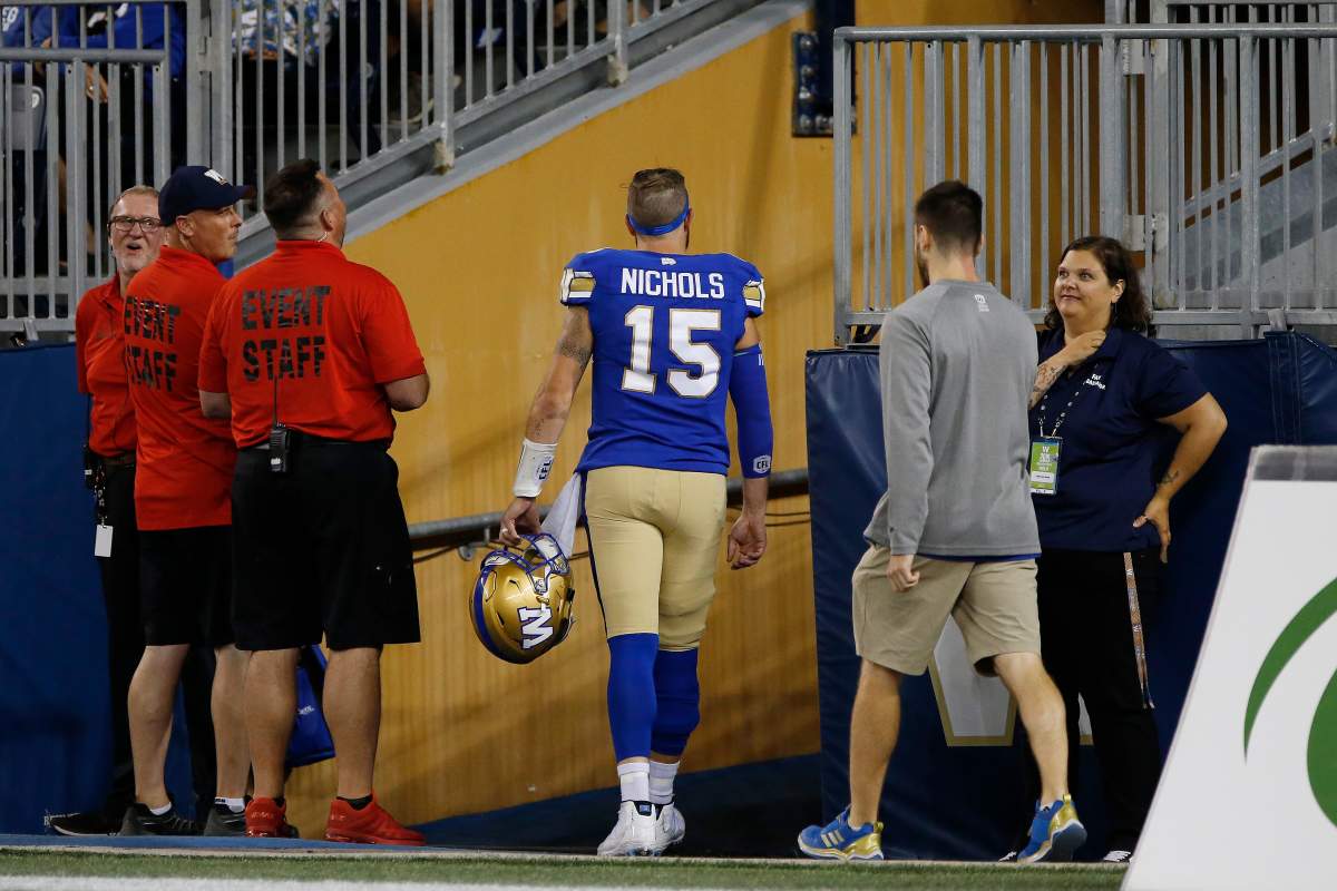 Winnipeg Blue Bombers quarterback Matt Nichols (15) leaves the field with an upper body injury against the BC Lions in the second half of CFL action in Winnipeg Thursday, August 15, 2019.