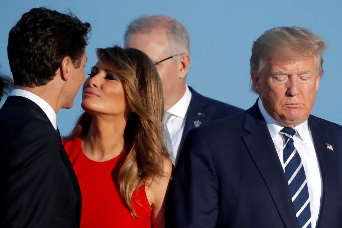 First Lady Melania Trump kisses Canada’s Prime Minister Justin Trudeau next to the U.S. President Donald Trump during the family photo with invited guests at the G7 summit in Biarritz, France, Aug. 25, 2019.