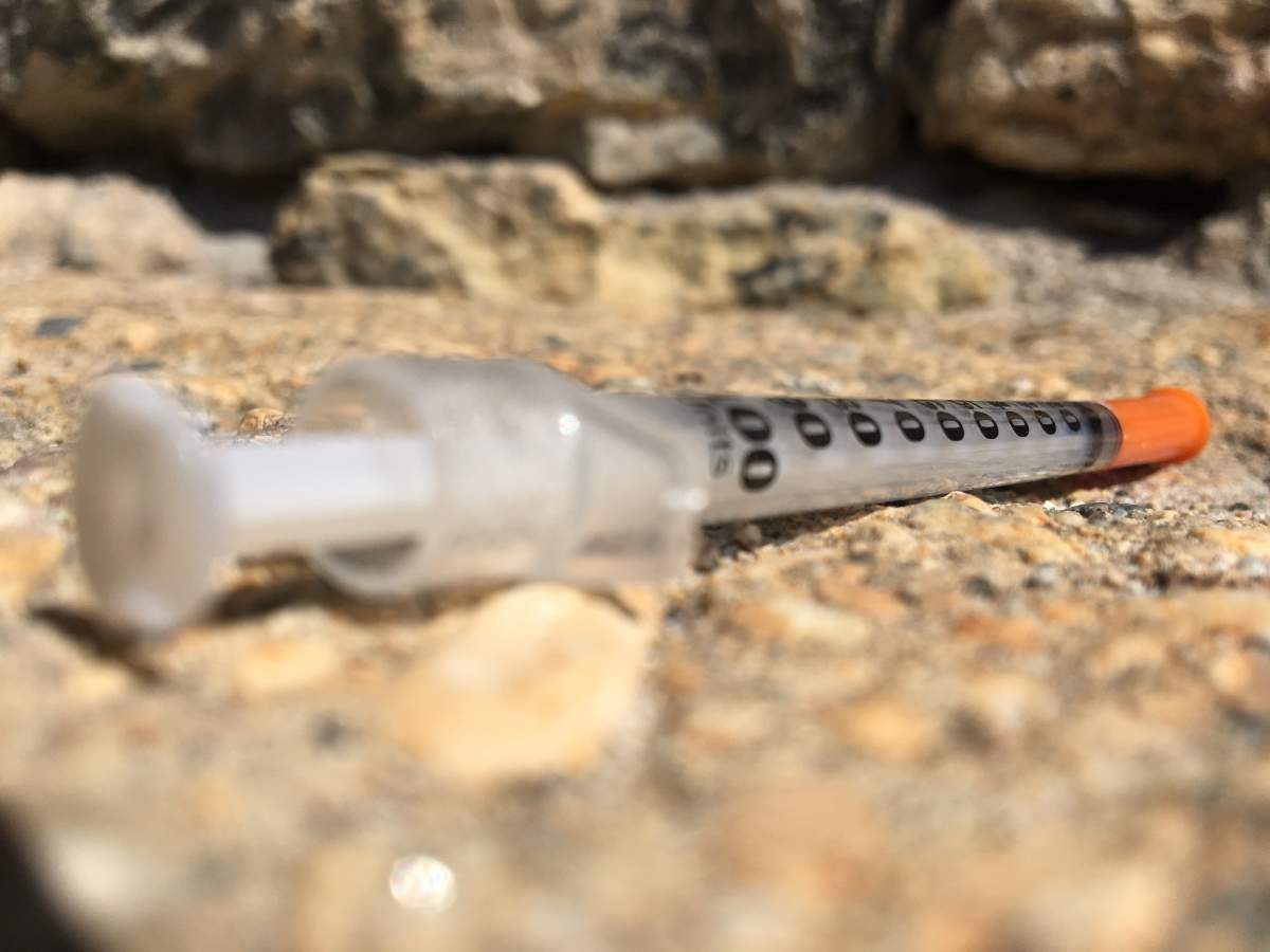 Needle on the ground.