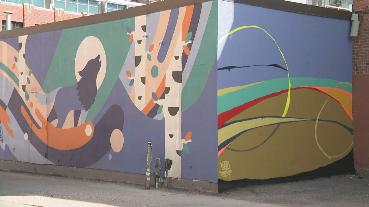 The mural on the right is one of many painted at the 2019 BUMP Festival.