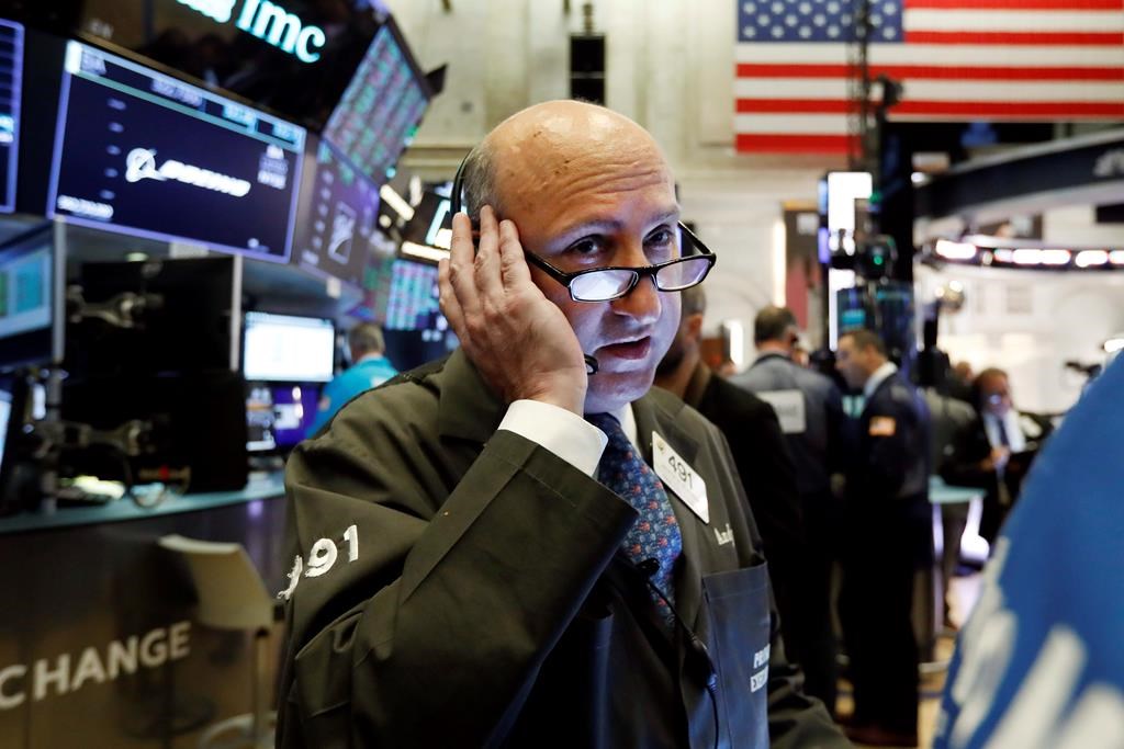 Trader Andrew Silverman works on the floor of the New York Stock Exchange, Thursday, Aug. 15, 2019. Stocks fells sharply on Monday, Feb. 24, 2020 amid fears of a COVID-19 pandemic.