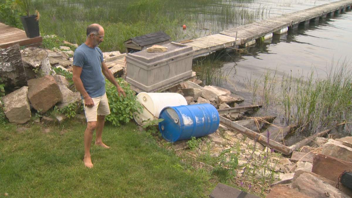 André Grand-Maison shows where the water level is at his home in Notre-Dame-de-l'Île-Perrot. Tuesday, August 06, 2019.