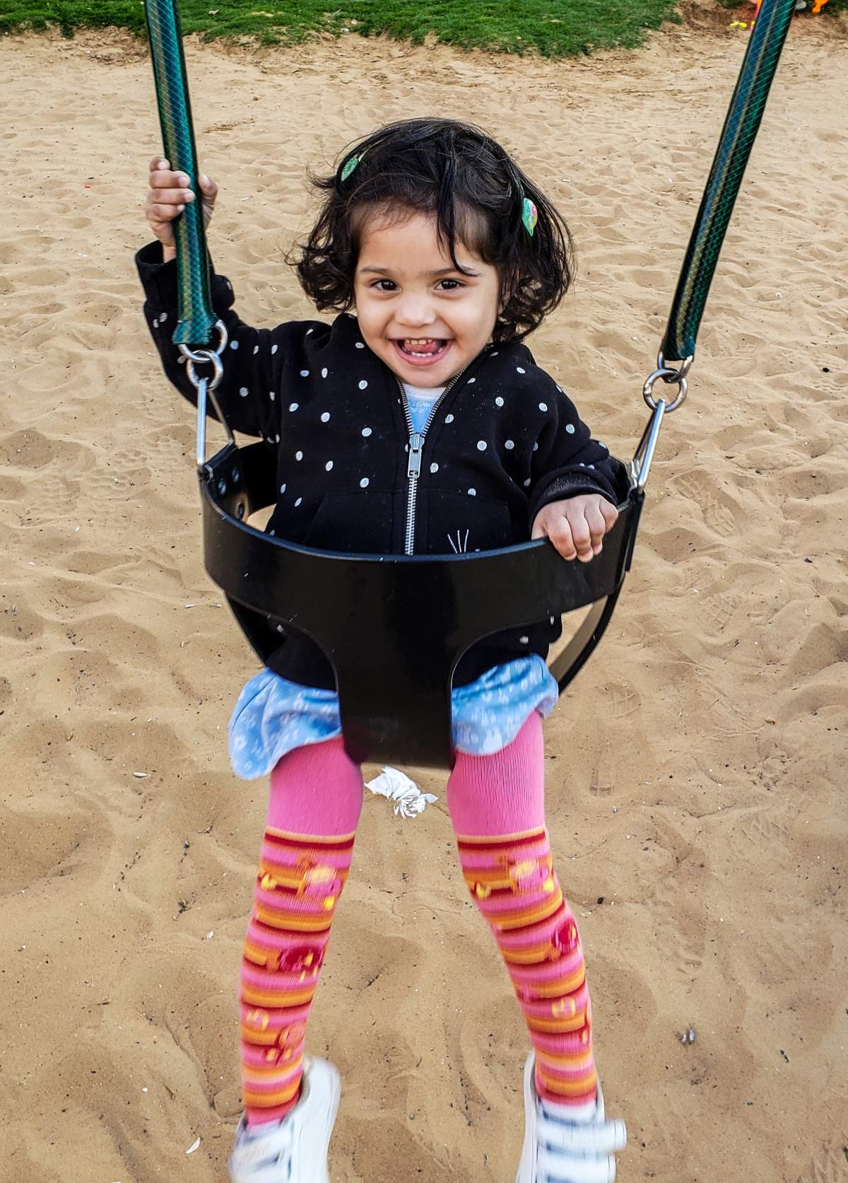 Ayat Ahmed playing on a swing in the UAE, March 2019.