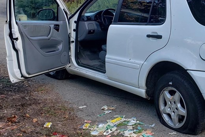 Bandages are shown in near a minivan with two flat tires in Mission Viejo, Calif., on Aug. 20, 2019.