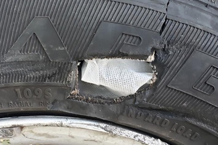 A hole stuffed with gauze is shown on a minivan in Mission Viejo, Calif., on Aug. 20, 2019.