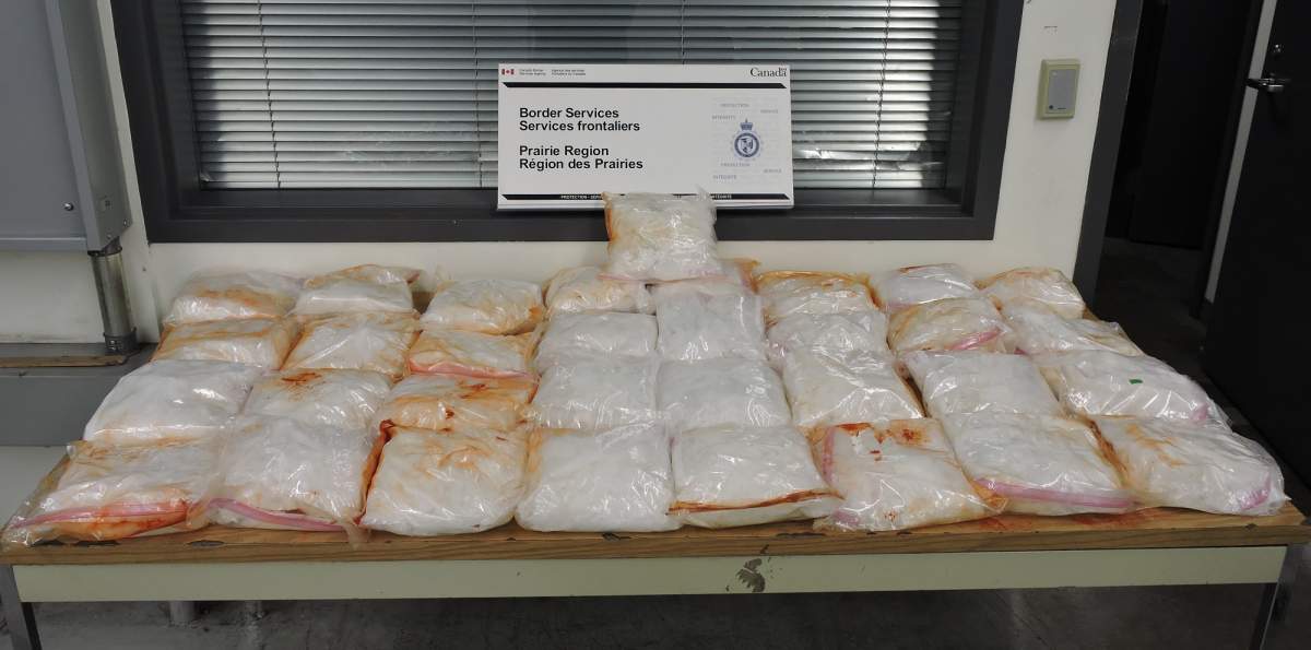 While searching his vehicle, officers uncovered 33 bags of methamphetamine with a total weight of approximately 50 kg.