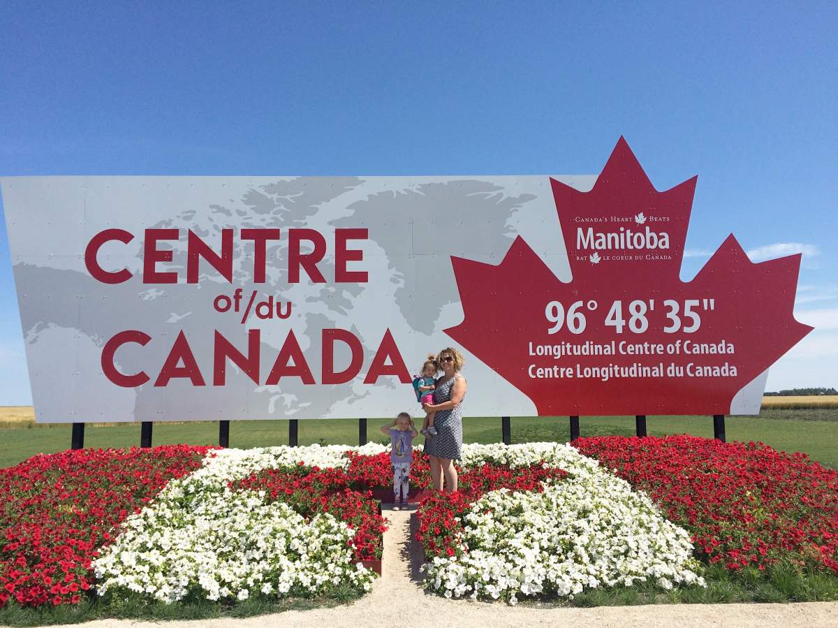 Carmen Kaephler and her daughters at the longitudinal centre of Canada in the RM of Tache. Kaephler has created a list of 101 Manitoba roadside attractions.