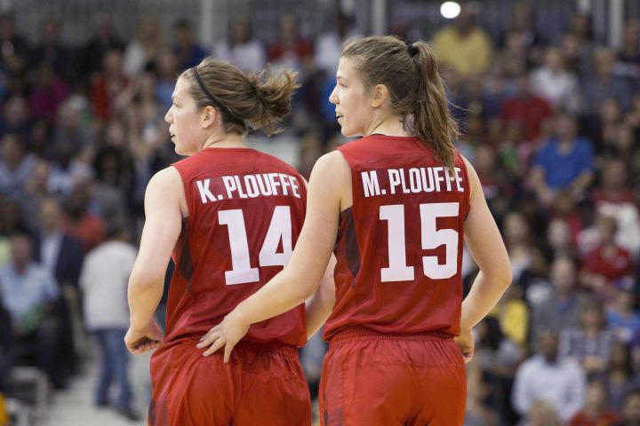 Michelle Plouffe (right) jogs back to her defensive position with sister Katherine during women's basketball action against Argentina at the Pan Am games in Toronto on Friday, July 17, 2015. Katherine and Michelle Plouffe raised some eyebrows when they announced their retirement from Canada's women's basketball team earlier this year. 