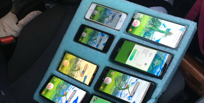 Eight phones attached to a piece of foam, all of them displaying Pokemon Go when a driver was caught playing them in Washington state.