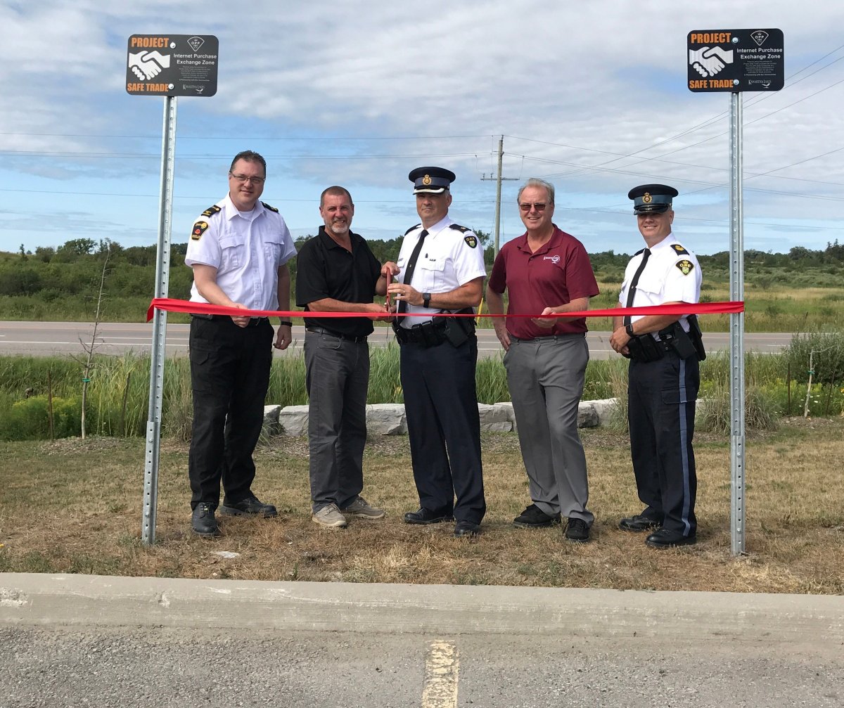 Project Safe Trade was launched at the Kawartha Lakes OPP detachment in Lindsay on Thursday. Taking part in the launch were, from left, municipal law enforcement manager Aaron Sloan, Mayor Andy Letha, OPP Insp.  Tim Tatchell, Coun. Ron Ashmore and Staff Sgt. Robert Flindall..