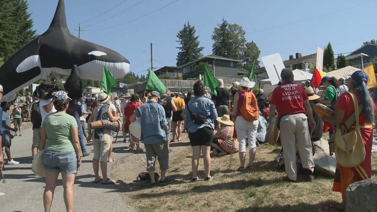 Protesters gather outside the Westridge Marine Terminal in Burnaby, B.C. against the Trans Mountain pipeline expansion on Aug. 5, 2019.