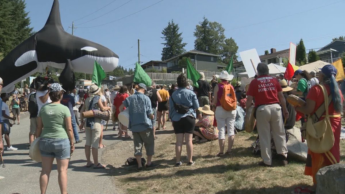 Protesters gather outside the Westridge Marine Terminal in Burnaby, B.C. against the Trans Mountain pipeline expansion on Aug. 5, 2019.