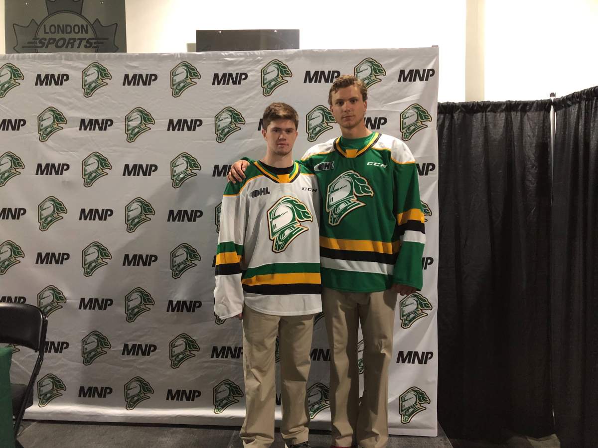 Connor McMichael, left, and Alec Regula pose with the London Knights' jersey for the 2019-2020 season.
