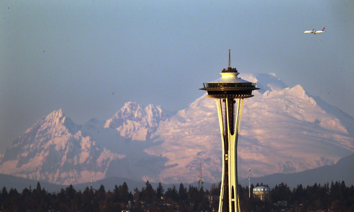 Seattle police are investigating an incident that saw a man launch into a racist tirade, only to have his target retaliate with a hammer. 