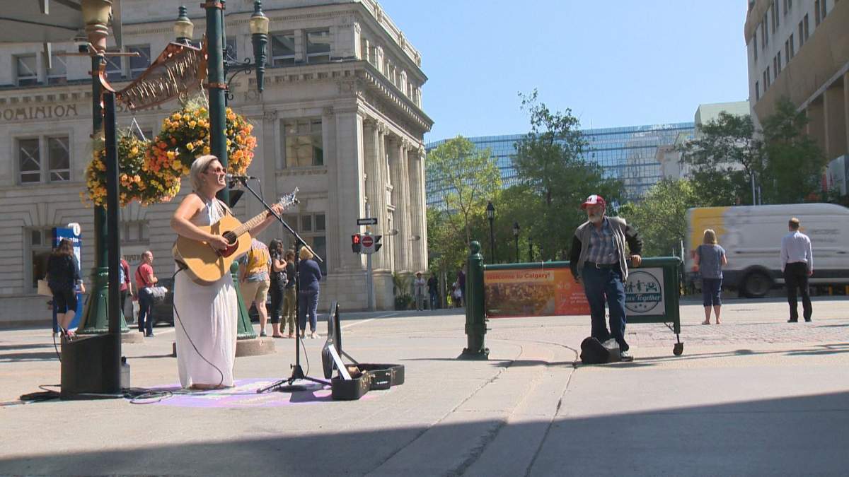 An artist performs on Calgary's Stephen Avenue on Thursday, August 1. 