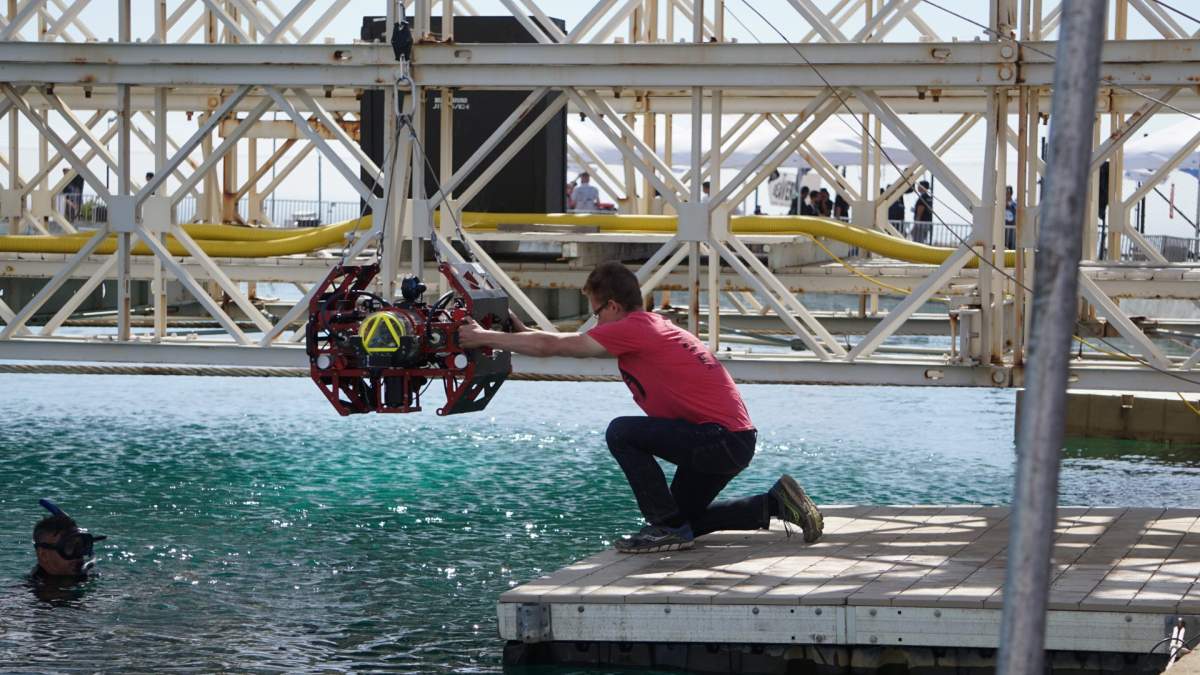 A member of the U of A's ARVP with Auri 2.0, the robot that won them 4th place this weekend. 