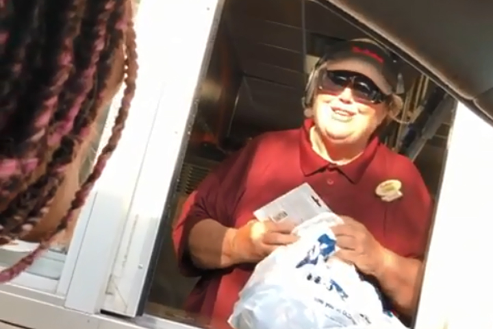 Lamiyah Jabbar, left, surprises a woman named Diane with gifts at a Tim Hortons in Buffalo, N.Y., on Aug. 3, 2019.