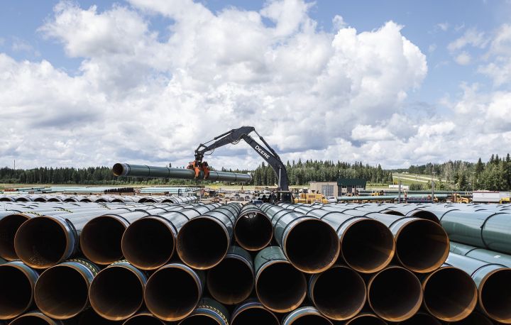 Pipe for the Trans Mountain pipeline is unloaded in Edson, Alta. on Tuesday June 18, 2019. A coalition of 32 environmental and Indigenous groups is calling on 27 insurance companies to drop or refuse to provide coverage of the Trans Mountain pipeline, although they concede its lead liability insurer is planning to continue coverage. 