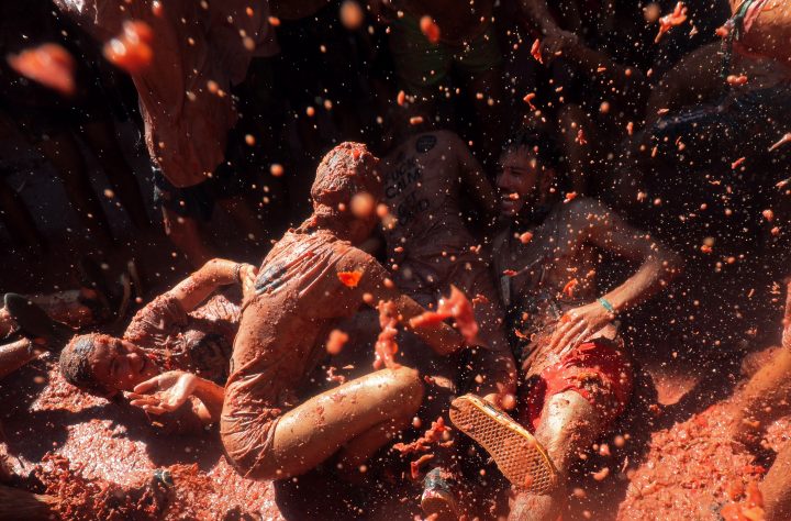 Revellers throw tomatoes during the annual “La Tomatina” food fight festival in Bunol, near Valencia, Spain, August 28, 2019.