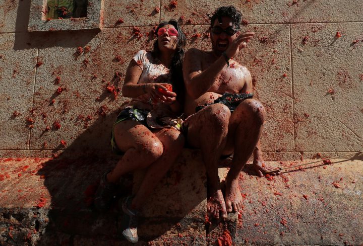Revellers react during the annual “La Tomatina” food fight festival in Bunol, near Valencia, Spain, August 28, 2019.