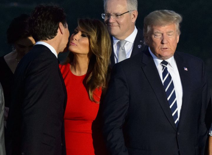 Prime Minister Justin Trudeau greets Melania Trump as she arrives to a family photo with husband U.S. President Donald Trump during the G7 Summit in Biarritz, France, on Sunday, Aug. 25, 2019.