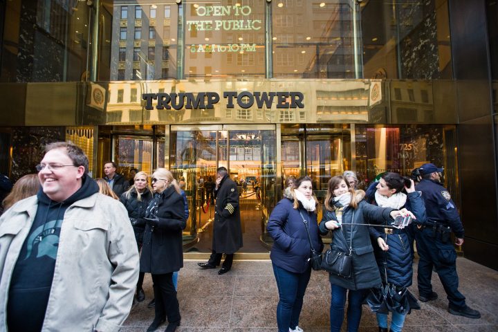 People take selfies in front of Trump Tower on 5th Avenue in New York City, NY., on Saturday, Nov. 18, 2017.