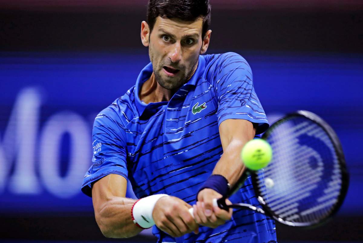 Novak Djokovic, of Serbia, returns to Juan Ignacio Londero, of Argentina, during the second round of the U.S. Open tennis tournament in New York, Wednesday, Aug. 28, 2019.