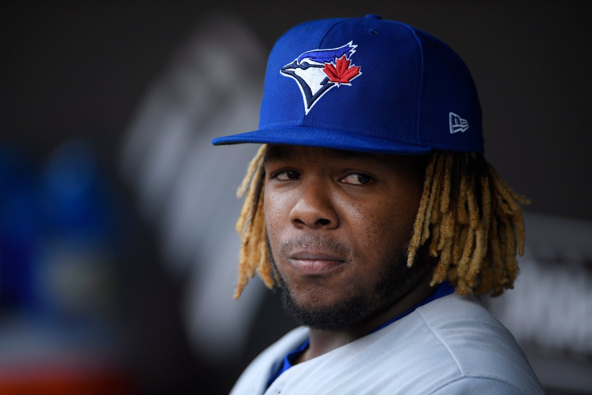 Toronto Blue Jays' Vladimir Guerrero Jr. stands in the dugout before a baseball game against the Baltimore Orioles, Sunday, Aug. 4, 2019, in Baltimore.