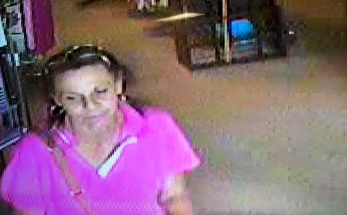 The alleged wig thief wore a bright pink collared shirt in footage obtained from the store’s video cameras.