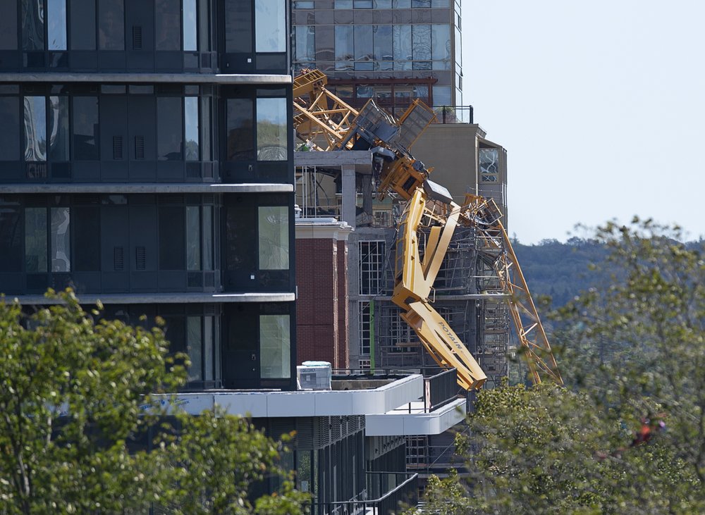 The twisted remains of a building crane hang off a construction project in Halifax Nova Scotia in the wake of Dorian, Sunday, Sept. 8, 2019.