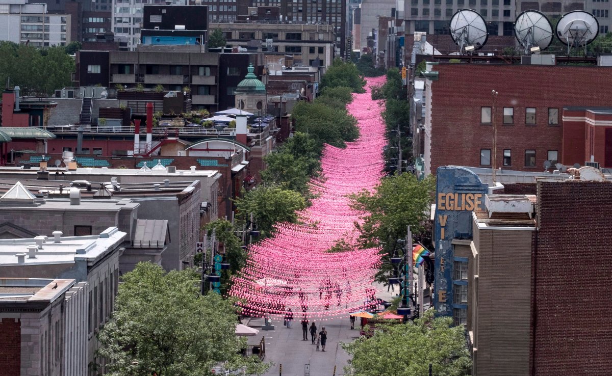 The strings of plastic balls above Ste-Catherine Street were initially pink. In 2017, the art installation became a rainbow.